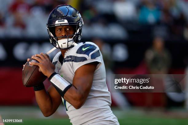 Quarterback Geno Smith of the Seattle Seahawks warms up before the game against the Arizona Cardinals at State Farm Stadium on November 06, 2022 in...