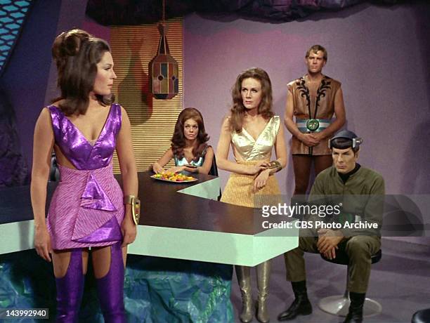 Marj Dusay as Kara, far left, talks to Sheila Leighton as Luma, center, with Leonard Nimoy as Mr. Spock, far right, in the STAR TREK episode,...