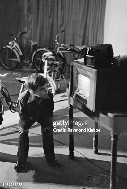 Young boy watching a CBS monitor as an television show is filmed at CBS Broadcast Center in New York City, New York, December 1951. Original...