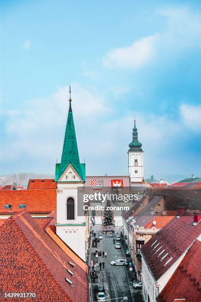 st. mark's church tower and rooftops in zagreb in winter - zagreb stock pictures, royalty-free photos & images