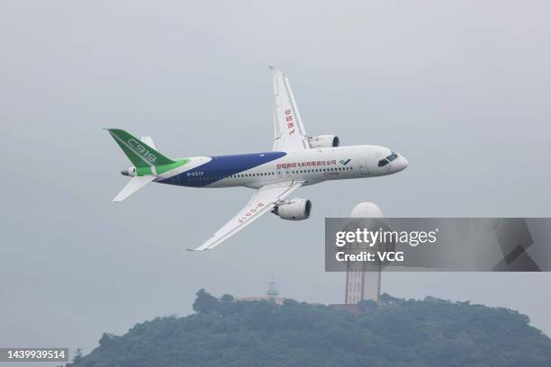 Large passenger aircraft performs in the sky on the opening day of the 14th China International Aviation and Aerospace Exhibition, or Airshow China...