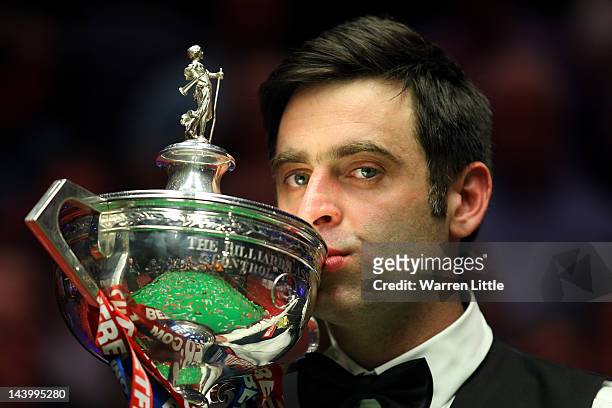 Ronnie O'Sullivan kisses the trophy after beating Allister Carter of England in the final of the Betfred.com World Snooker Championship at the...