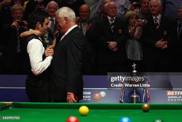 Ronnie O'Sullivan of England is congratulated by Barry Hearn, World Snooker Chairman after beating Allister Carter of England in the final of the...