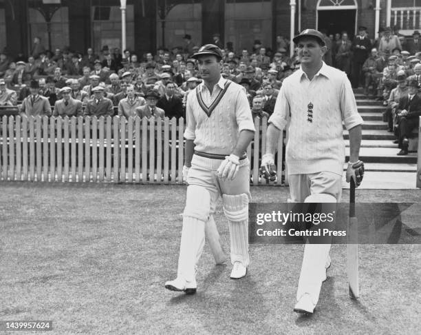 Don Kenyon and Tom Graveney of England walk to the wicket to open the 1st innings of the 1st Test match of the England versus South Africa Test match...