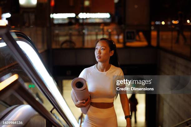 urban athlete going to gym. - escalators stock pictures, royalty-free photos & images