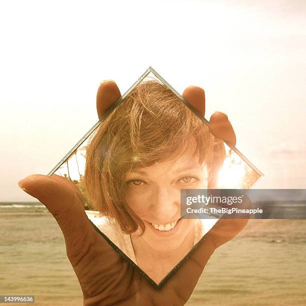 hand holding compact mirror - woman holding hand mirror stock pictures, royalty-free photos & images