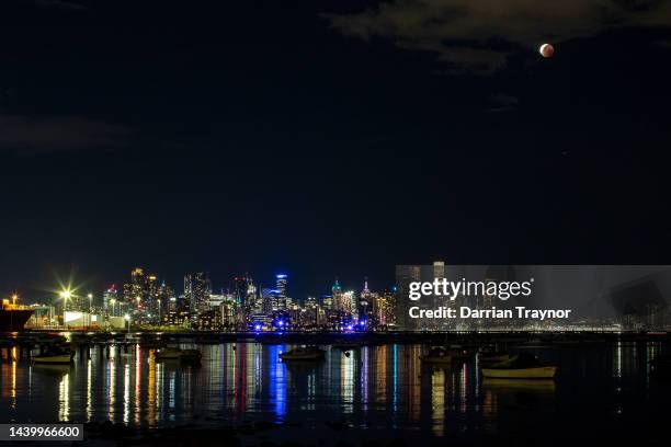 The 'Blood Moon' or lunar eclipse is seen from Williamstown in Melbourne on November 08, 2022 in Melbourne, Australia. Australians will experience...