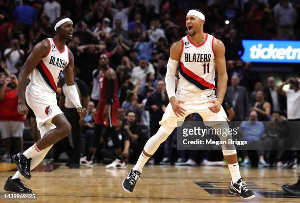 Josh Hart of the Portland Trail Blazers celebrates with teammates after hitting the game winning shot against the Miami Heat during the fourth...
