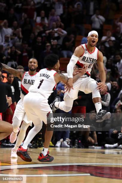 Josh Hart of the Portland Trail Blazers celebrates with teammates after hitting the game winning shot against the Miami Heat during the fourth...