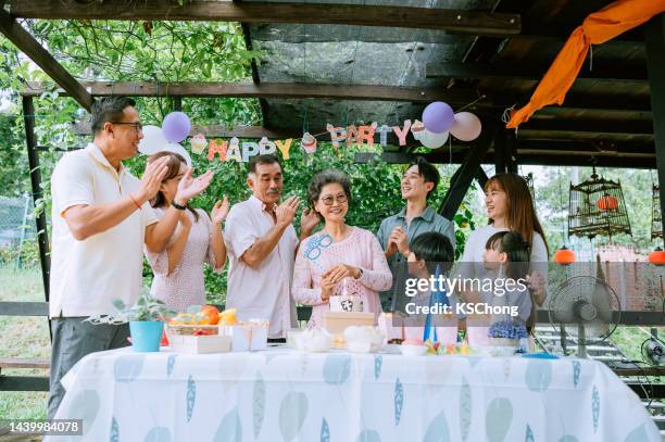 asian chinese portrait of multi generation family celebrate birthday - granny flat stock pictures, royalty-free photos & images