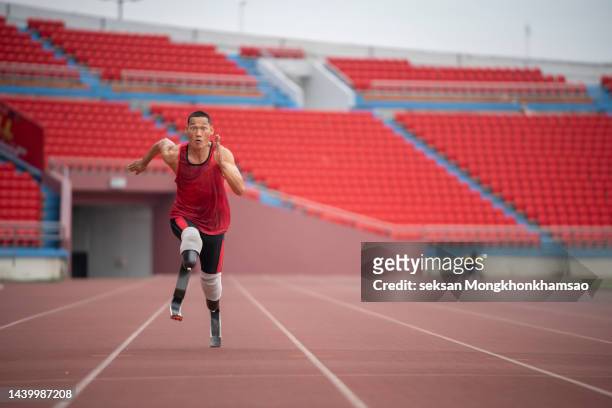 disabled man athlete training with leg prosthesis. - paralympics track stock pictures, royalty-free photos & images