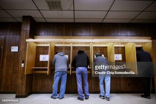 Voters fill out their ballots at the Oshkosh Town Hall during the U.S. Midterm elections on November 08, 2022 in Oshkosh, Wisconsin. After months of...