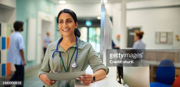 medcial consultant portrait - busy hospital lobby stock pictures, royalty-free photos & images