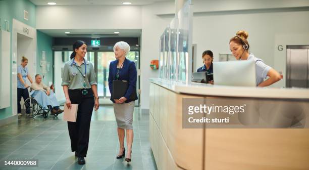 hospital doctor with administrator - nhs stock pictures, royalty-free photos & images