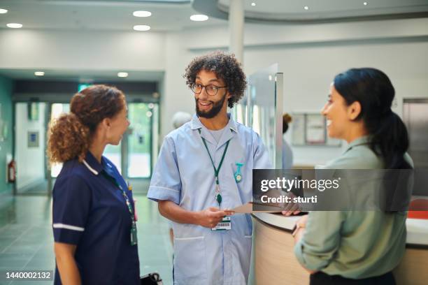 medical team chat - nurse paperwork stock pictures, royalty-free photos & images
