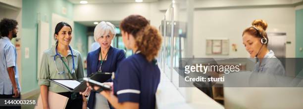 administrator with medical team - hospital leadership stock pictures, royalty-free photos & images