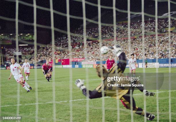 Sun Wen, Captain and Forward for China scores a penalty kick against the diving Bente Nordby, Goalkeeper for Norway during their Semi Final match of...