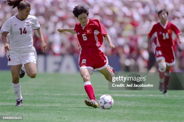 Zhao Lihong, Midfielder for China and Joy Fawcett, Right Back of the United States in motion during the Final match of the FIFA Women's World Cup...