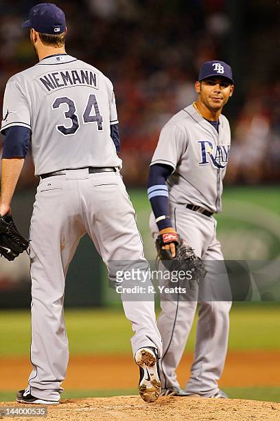 Evan Longoria of the Tampa Bay Rays reacts to Jeff Niemann during the game against the Texas Rangers at Rangers Ballpark in Arlington on April 28,...