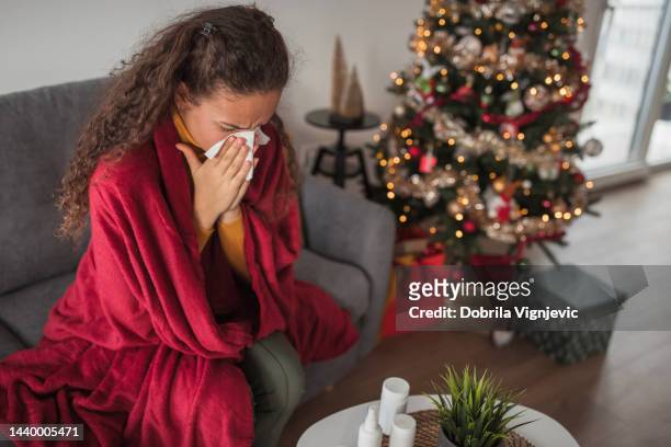 girl sitting at home during winter holidays with a flu virus - cold virus stock pictures, royalty-free photos & images