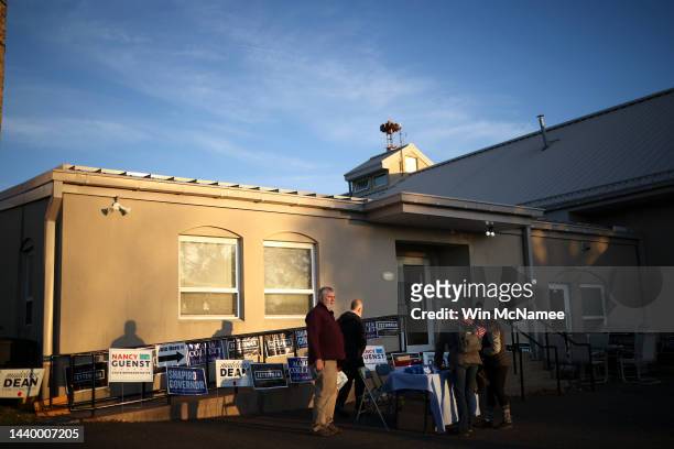 Pennsylvania Democratic Party volunteers gather for election day outside the Bryn Athyn Borough Hall polling station on November 08, 2022 in...