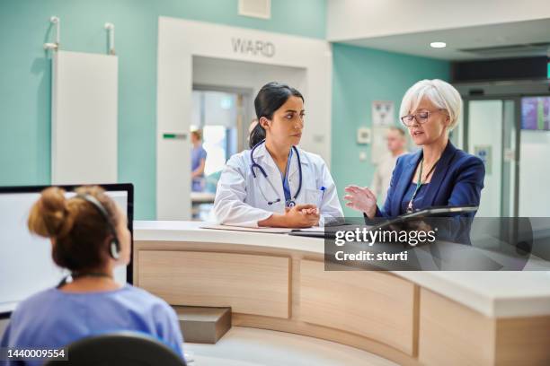 administrator with hospital doctor - administrator stock pictures, royalty-free photos & images
