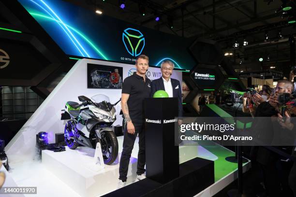 Kimi Räikkönen and Hiroshi Ito attends at Yamaha stand during the EICMA International Exhibition Cycle Motorcycle and Accessories show on November...