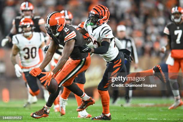 Chidobe Awuzie of the Cincinnati Bengals covers Amari Cooper of the Cleveland Browns during the first half at FirstEnergy Stadium on October 31, 2022...