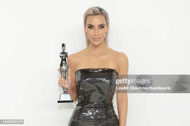 Kim Kardashian poses with the Amazon Innovation Award during the CFDA Fashion Awards at Casa Cipriani on November 07, 2022 in New York City.