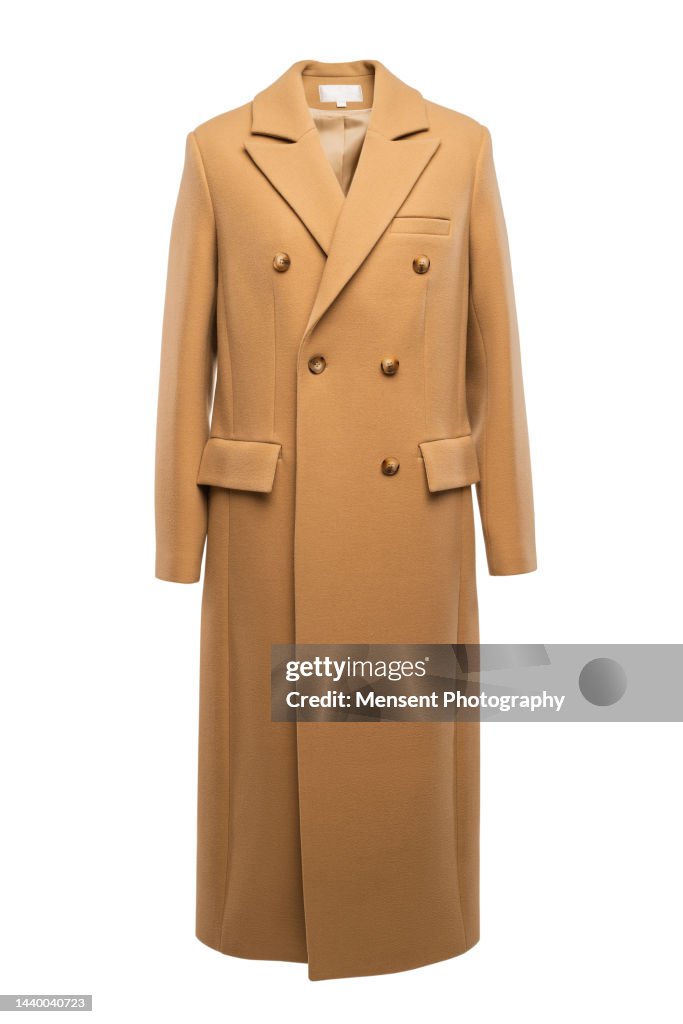 Women's fashionable yellow coats isolated on white background, invisible mannequin