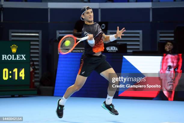 Francesco Passaro of Italy returns a forehand during his match against Jiri Lehecka of Czech Republic during day one of the Next Gen ATP Finals at...