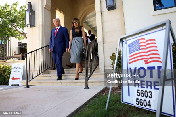 Former U.S. President Donald Trump and former first lady Melania Trump walk together after voting at a polling station setup in the Morton and...