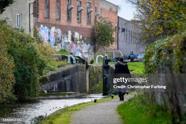 People walk along a canal tow path in Hodge Hill on November 08, 2022 in Birmingham, England. The Priority Places for Food Index, based on new...