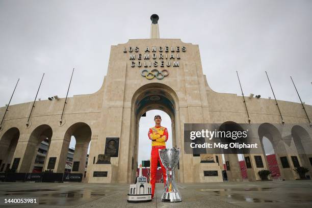 Joey Logano, driver of the Shell Pennzoil Ford, poses with the Bill France NASCAR Cup Series Championship trophy and his NASCAR Clash at the Coliseum...