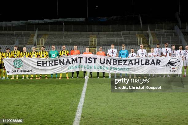 Volunteers hold a sign with the inscription "Danke ans Ehrenamt", a thank you to all the volunteers and honorary workers in Sport during the 3. Liga...