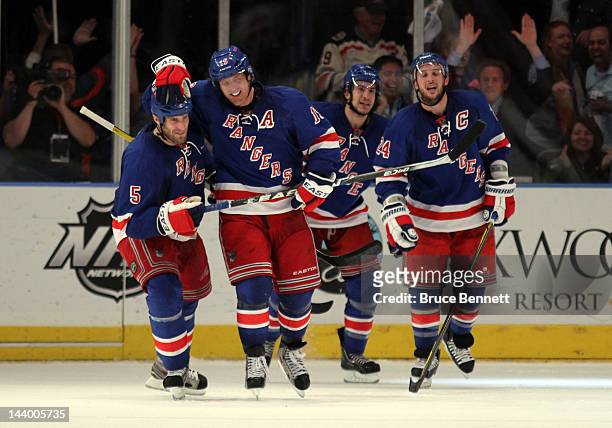 Brad Richards of the New York Rangers celebrates with teammate Dan Girardi after scoring a goal to tie up the game late in the third period against...