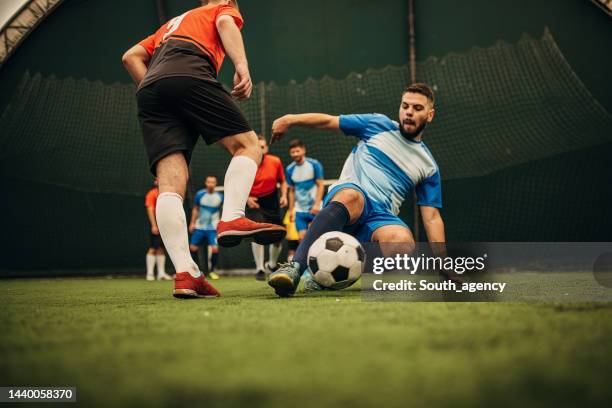 slide tackle - slide tackle stock pictures, royalty-free photos & images