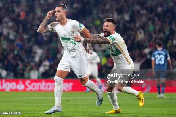 Pol Lirola of Elche CF celebrates after scoring their team's first goal during the LaLiga Santander match between Elche CF and Girona FC at Estadio...