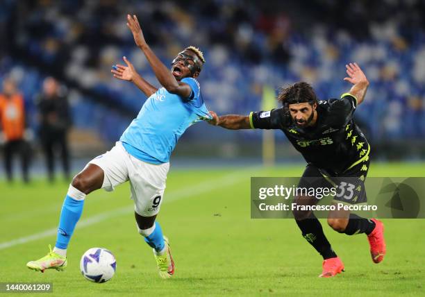 Victor Osimhen of SSC Napoli has their shirt pulled by Sebastiano Luperto of Empoli FC during the Serie A match between SSC Napoli and Empoli FC at...