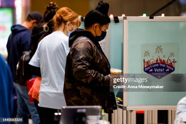 Voters stand in voting booths as they fill out their ballots at a polling center at the Meadows Mall on November 08, 2022 in Las Vegas, Nevada. After...