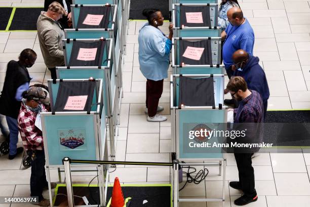 Voters stand in voting booths as they fill out their ballots at a polling center at the Meadows Mall on November 08, 2022 in Las Vegas, Nevada. After...