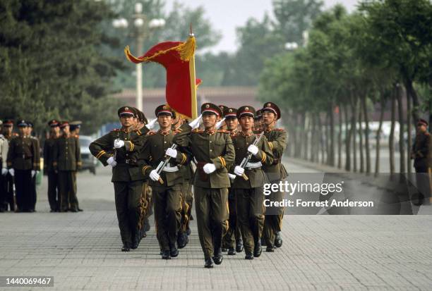 View of members of the People's Liberation Army Honor Guard as they march in Tiananmen Square, Beijing, China, May 1988. They were attending a...