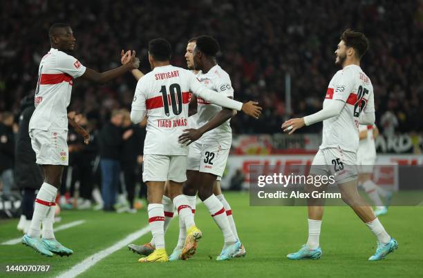 Sehrou Guirassy of VfB Stuttgart celebrates with teammates after scoring their side's first goal during the Bundesliga match between VfB Stuttgart...