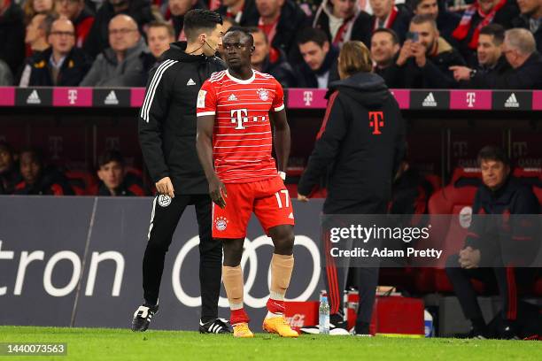 Sadio Mane of Bayern Munich receives medical treatment during the Bundesliga match between FC Bayern Muenchen and SV Werder Bremen at Allianz Arena...