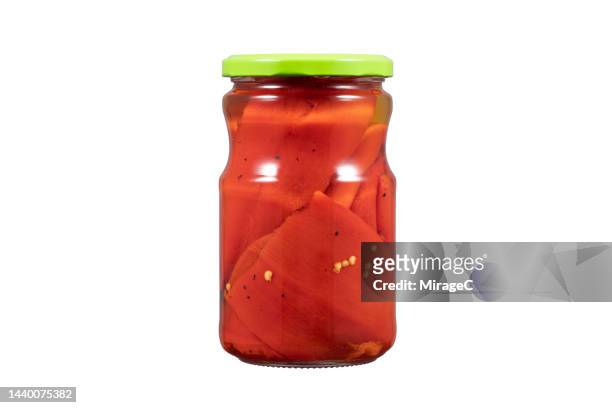 roasted red pepper preserved in glass jar isolated on white - roasted pepper stock pictures, royalty-free photos & images