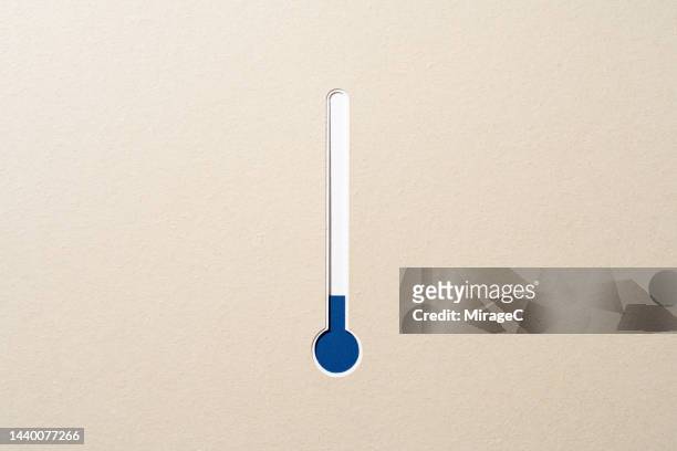 blue thermometer indicates low temperature, paper cut craft - termometer bildbanksfoton och bilder