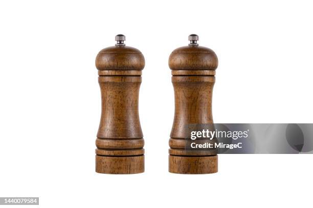 brown wood pepper mill and salt mill isolated on white - peppar bildbanksfoton och bilder