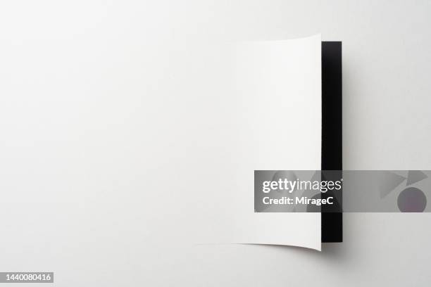 curved paper page cut out from white paper - breakthrough stock pictures, royalty-free photos & images