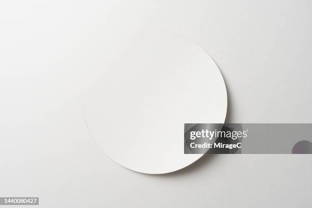 circle shape cut out from white paper - cutting corners stock pictures, royalty-free photos & images