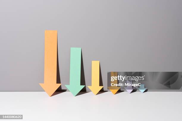 reduced bar graph consisting of falling arrows - system failure stock pictures, royalty-free photos & images